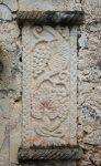 San Juan Bautista, façade portal, left pilaster relief