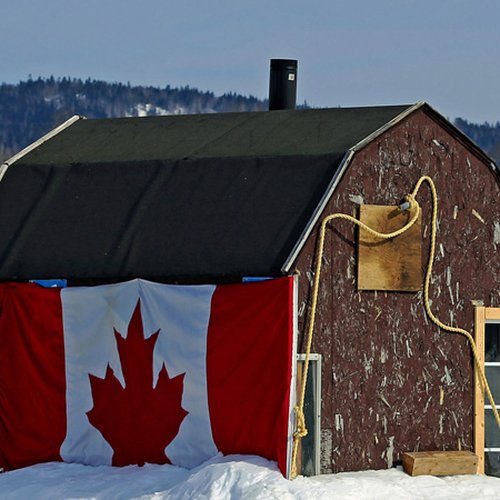 A patriotic fishing hut on Belleisle Bay with packed snow around it for extra insulation.