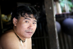 Man outside a Longhouse in Sarawak in Borneo_0013