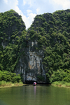 Boat entering Tam Coc cave, Ninh Binh, Vietnam