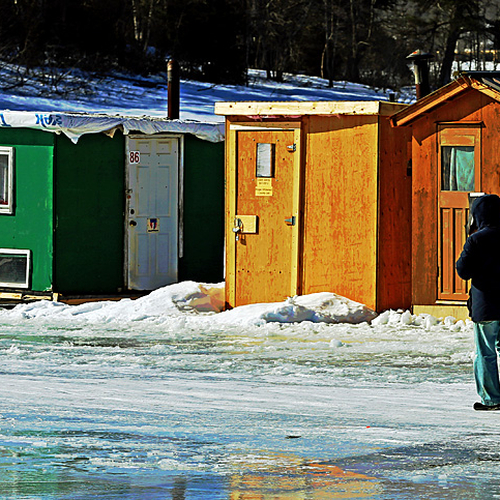 Taking a morning stroll by the ice huts located near Renforth Wharf in Rothesay, New Brunswick.