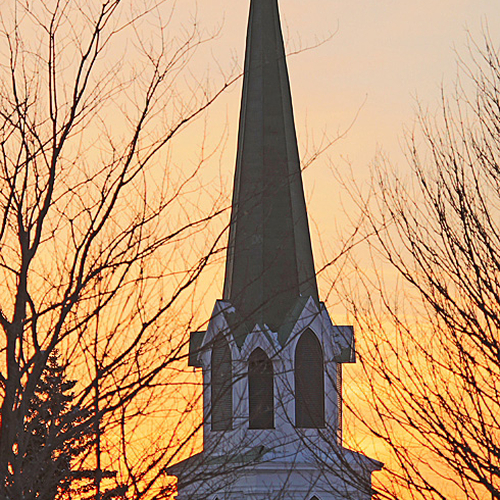 The steeple of St. Paul's Anglican church at twilight.