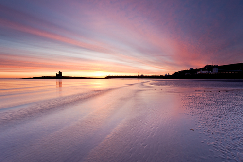 Douglas Head and The Tower of Refuge against a glorious January sunrise sky. A cold morning warmed by the glow of the…