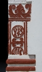 San Lorenzo, façade, main portal, right pilaster relief, Christograms
