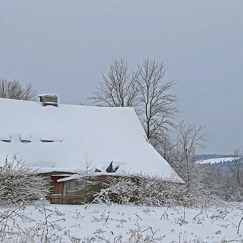 A period barn with distinctive and character lean endures yet another winter.