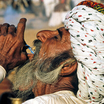 Rajastani Man drinking water, India