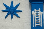Façade, choir window pier relief (left) & sun