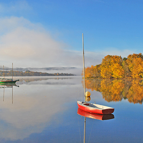 This image was captured on a dead calm day in early October. The early morning fog had lifted just enough to expose t…