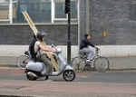 Scooter carrying wood