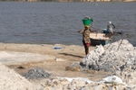 Senegal Lac Rose salt production 5 woman carrying salt from boat to sh