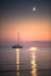 ab638 Lone yacht under the Crescent Moon