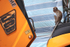 Long tail macaque sat in a JCB seat in the heart of Kuala Lumpur.
