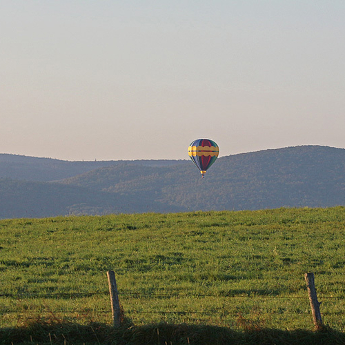 A solo balloon floats softly along the Kennebecasis River valley on Friday morning, September 6th, 2013. The balloon…