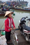 Lady on a ferry, the Thu Bon River