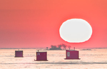 SUNRISE OVER ICE HUTS - INNER BAY, LONG POINT