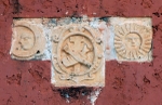 Santa Inés, façade reliefs, moon, sun & Franciscan insignia