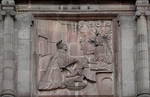 Façade, central relief, St. John of God washing Christ's feet