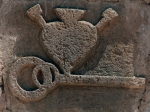 San Agustín, façade wall relief, key & Augustinian insignia