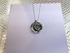 Silver rose pendant.  £75.00