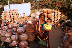 Pot seller with her baby - Jaipur Rajasthan