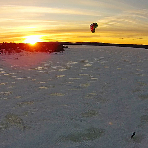 A snowkiter takes a sunset sail along the Kennebecasis @ Renforth, New Brunswick, Canada.