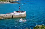 A boat returns past the Banjo Pier