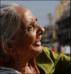 Porbander India woman holding out her hand comp