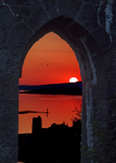 Sun setting through the window of McCaigs Tower
