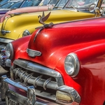 Line of brightly painted cars, Havana