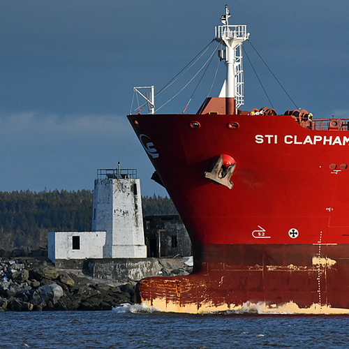 The oil/chemical tanker STI Clapham approaches the light/battery situated along the Courtenay Bay breakwater on the e…
