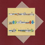 Beach huts and boats greetings card