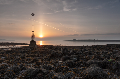 Daybreak at Derby Haven on a calm hazy morning.