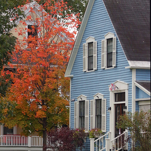 A century house along University Avenue in contrast with autumn's hues.