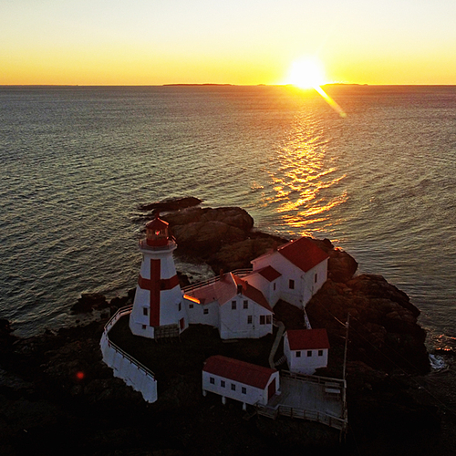 Aerial drone composition of East Quoddy Lighhouse at sunrise on gorgeous Campobello Island, NB Canada.