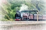 No stock TS61 - Royal Duchy Steam Train passin along the seawall