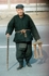 Man with stick and stool