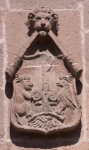 Façade, upper story escutcheon (right)