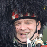 Man playing bagpipes, Scotland