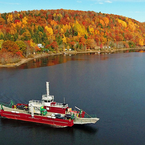The Belleisle Bay Cable Ferry is seen here with the autumn foliage of Kars, Kings County in the immediate background.