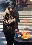 China Shanghai Temple girl by flame 3