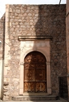 San Juan Bautista, San Miguel Arcángel, lateral portal