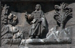 Façade, central panel, base relief (right): Heavens opening to Christ