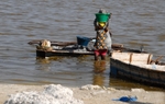 Senegal Lac Rose salt production 7 woman carrying salt from boat to sh
