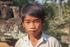 Young boy selling items to make money to live at Ankor Wat in Cambodia