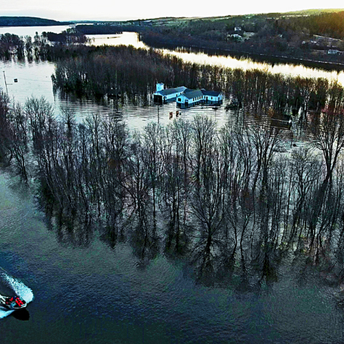 Spring Flood 2019 New Brunswick Canada - Aerial of Darlings Island Road, shuttle boat, abandoned SUV and with soon to…