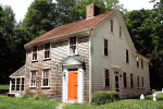cape house with orange door