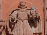 San Juan Bautista, façade portal architrave finial sculpture (right)