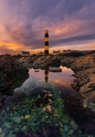 Lighthouse In A Rock Pool