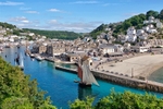 Luggers sailing down the River Looe