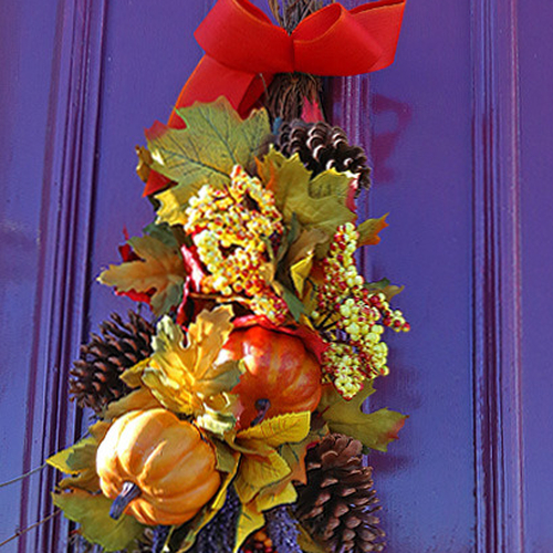 A purple church door adorned with seasonal decoration near Gagetown, New Brunswick.